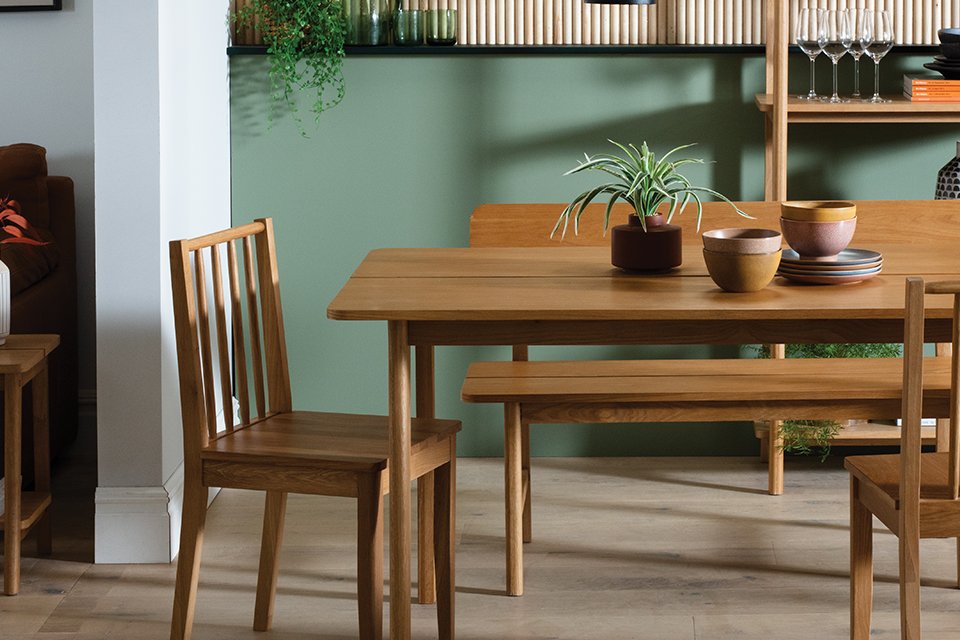 A Habitat nel wood 4 seater dining table in natural finish.